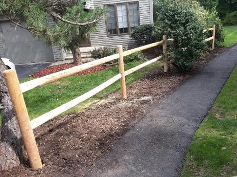 wood fence on side of house repaired