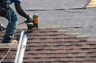 roofers installing a new roof on home